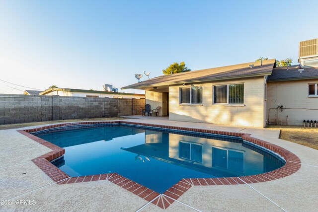 view of pool featuring a patio