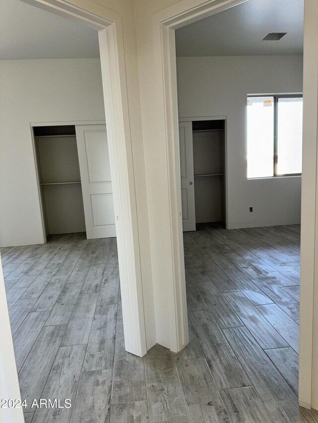 unfurnished room featuring ceiling fan and light hardwood / wood-style floors