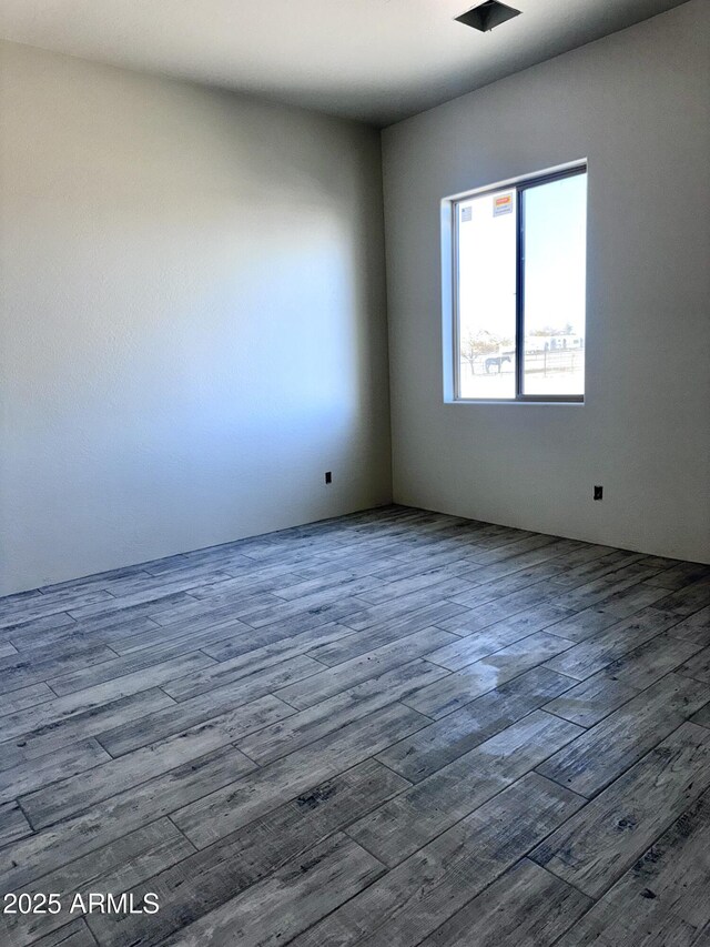 unfurnished living room with light hardwood / wood-style flooring and ceiling fan