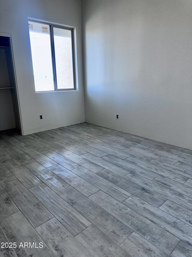 spare room featuring light hardwood / wood-style floors