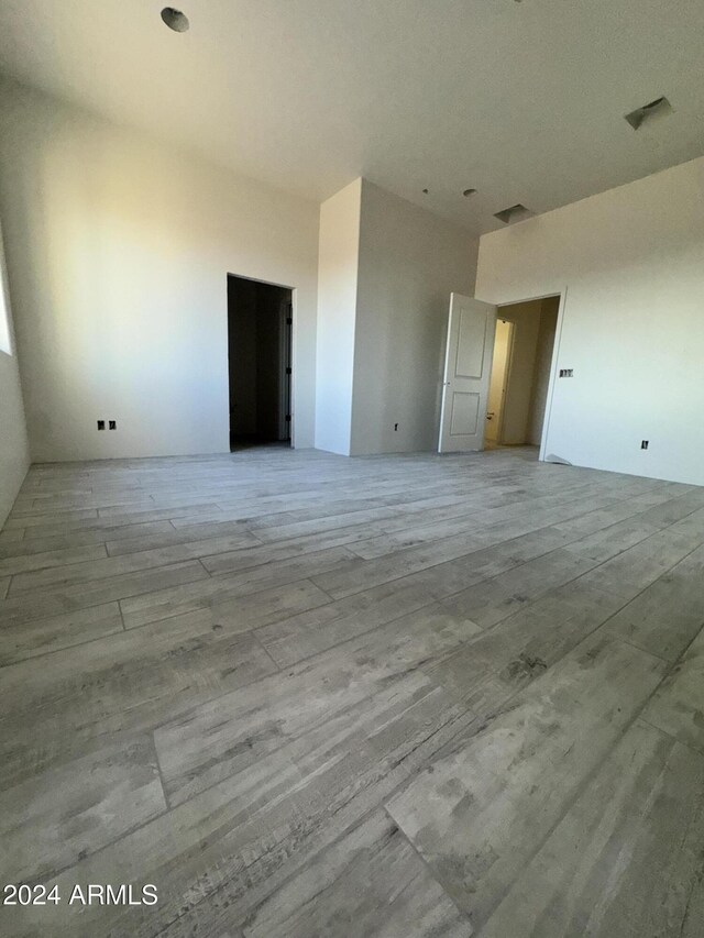 empty room featuring ceiling fan and light wood-type flooring