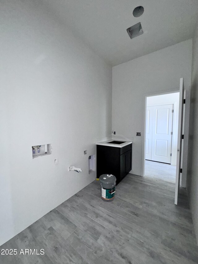 unfurnished living room featuring ceiling fan and light wood-type flooring