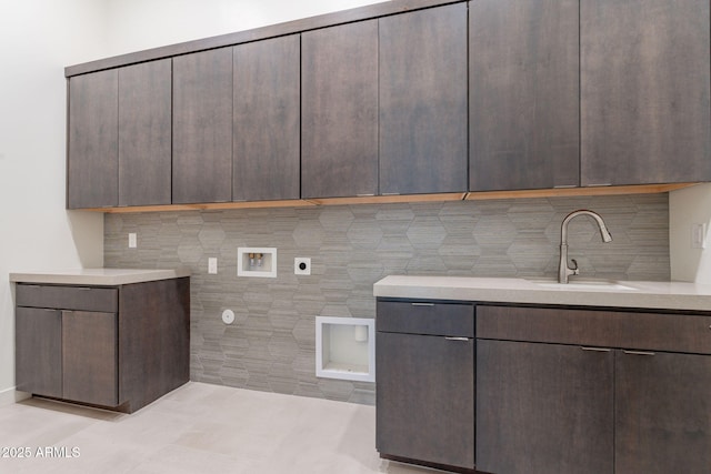 washroom featuring a sink, cabinet space, washer hookup, and electric dryer hookup