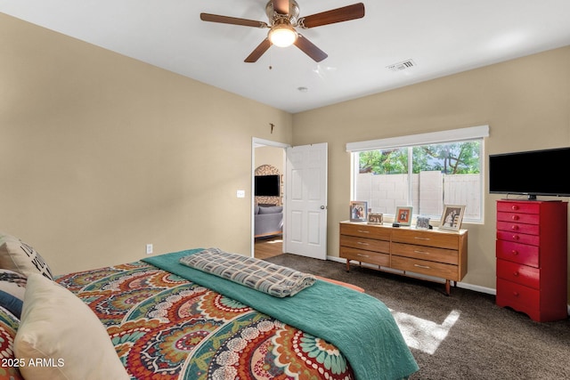 3221 N 37th St Unit 10, Phoenix, AZ 85018 - bedroom with dark carpet, a ceiling fan, and baseboards