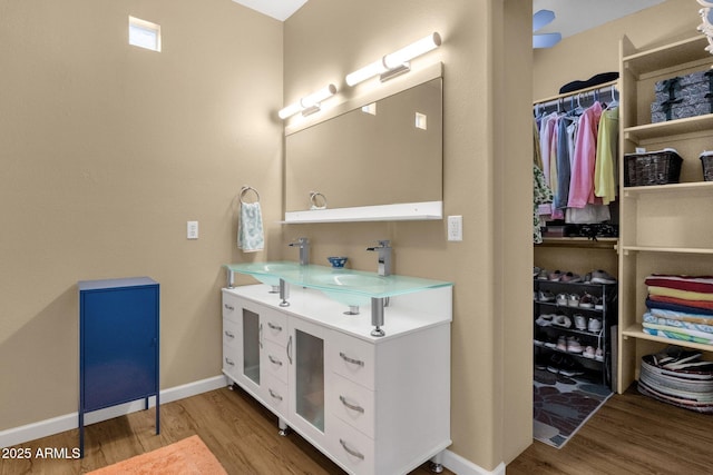3221 N 37th St Unit 10, Phoenix, AZ 85018 - full bathroom featuring wood finished floors, double vanity, and baseboards