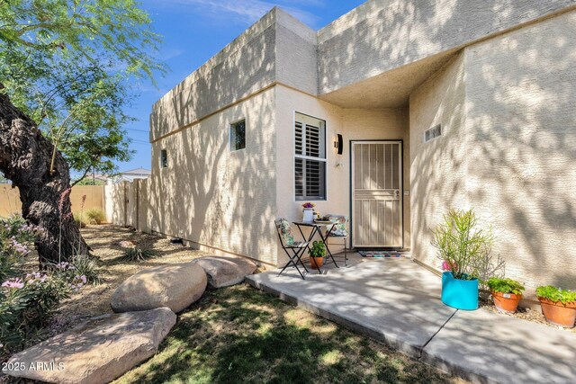 3221 N 37th St Unit 10, Phoenix, AZ 85018 - property entrance featuring stucco siding and a patio area