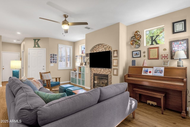 3221 N 37th St Unit 10, Phoenix, AZ 85018 - living area with a ceiling fan, a glass covered fireplace, wood finished floors, recessed lighting, and baseboards