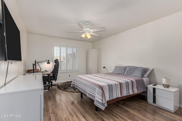 bedroom with ceiling fan and wood-type flooring