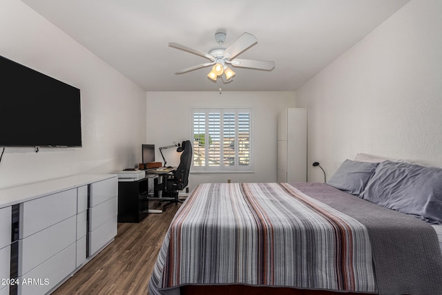 bedroom featuring ceiling fan and dark wood-type flooring