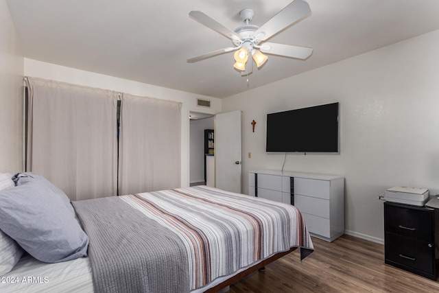 bedroom with hardwood / wood-style flooring and ceiling fan