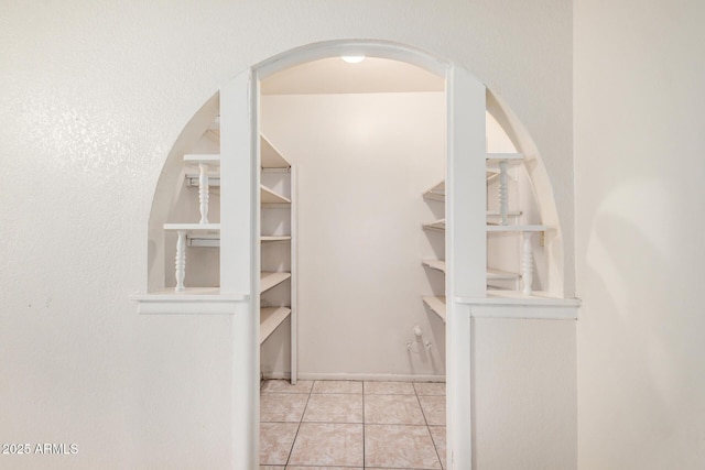 6430 W Thomas Rd, Phoenix, AZ 85033 - spacious closet with tile patterned flooring and arched walkways