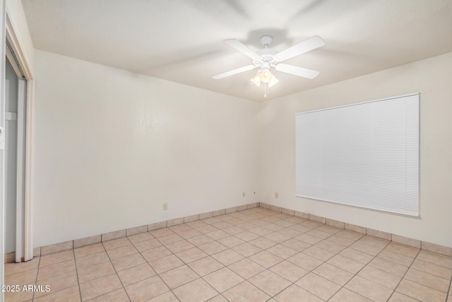 6430 W Thomas Rd, Phoenix, AZ 85033 - spare room featuring ceiling fan and light tile patterned flooring