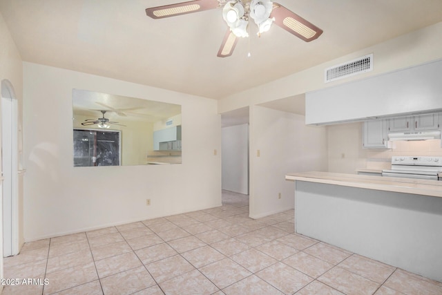 6430 W Thomas Rd, Phoenix, AZ 85033 - kitchen featuring white electric range, under cabinet range hood, light countertops, a ceiling fan, and light tile patterned floors