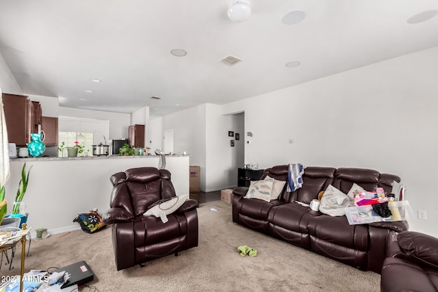 living room featuring light colored carpet