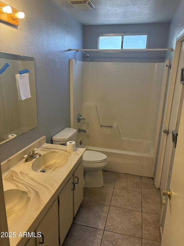 5542 W Monte Cristo Ave, Glendale, AZ 85306 - full bathroom with vanity, shower / bathtub combination, toilet, a textured ceiling, and tile patterned floors