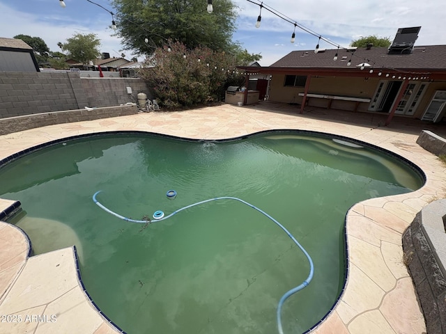 5542 W Monte Cristo Ave, Glendale, AZ 85306 - view of pool featuring a patio area and a fenced backyard