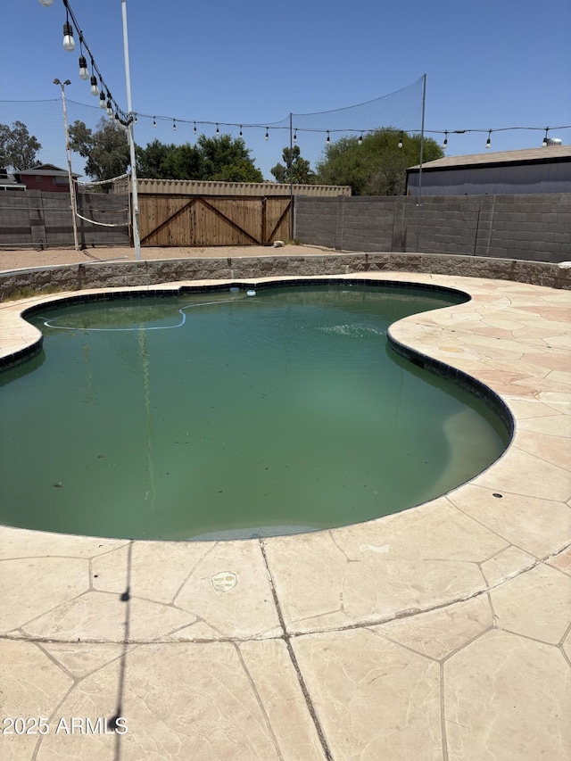 5542 W Monte Cristo Ave, Glendale, AZ 85306 - view of swimming pool featuring a fenced backyard and a patio