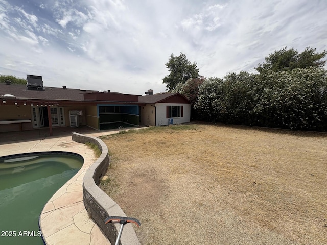 5542 W Monte Cristo Ave, Glendale, AZ 85306 - swimming pool with a patio area and french doors