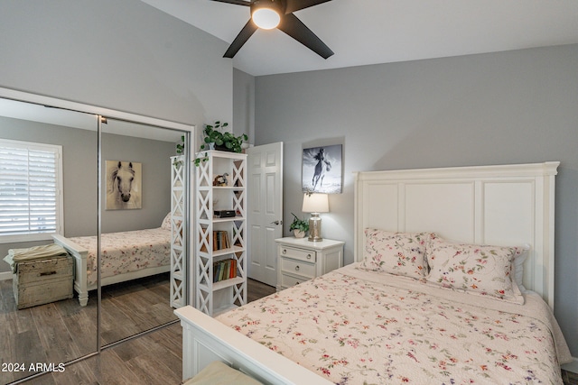 bedroom featuring vaulted ceiling, ceiling fan, a closet, and dark hardwood / wood-style flooring