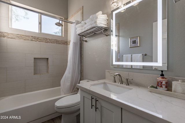 full bathroom with vanity, hardwood / wood-style floors, toilet, and shower / tub combo with curtain