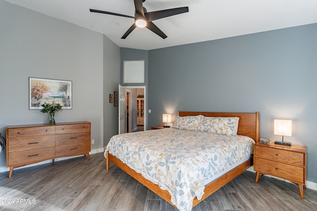 bedroom with lofted ceiling, ceiling fan, and dark hardwood / wood-style floors