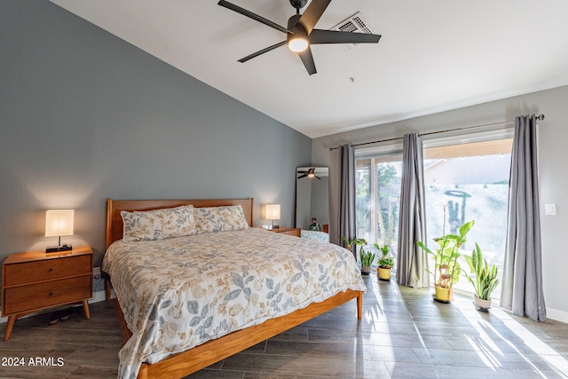 bedroom featuring ceiling fan, hardwood / wood-style floors, and vaulted ceiling