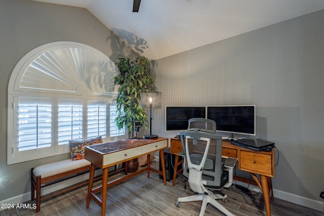 home office featuring lofted ceiling and wood-type flooring