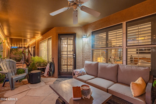 exterior space featuring outdoor lounge area and ceiling fan