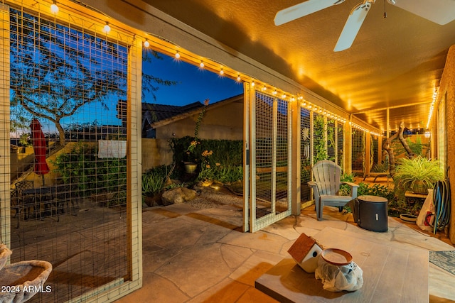 view of patio / terrace featuring ceiling fan