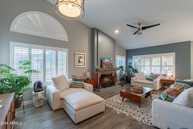 living room with hardwood / wood-style flooring, plenty of natural light, and a large fireplace