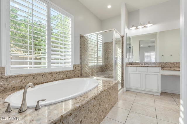 bathroom with shower with separate bathtub, tile patterned flooring, and vanity