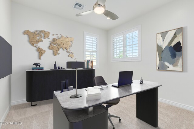 office area with ceiling fan and light carpet