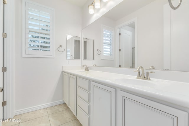 bathroom featuring tile patterned flooring and vanity