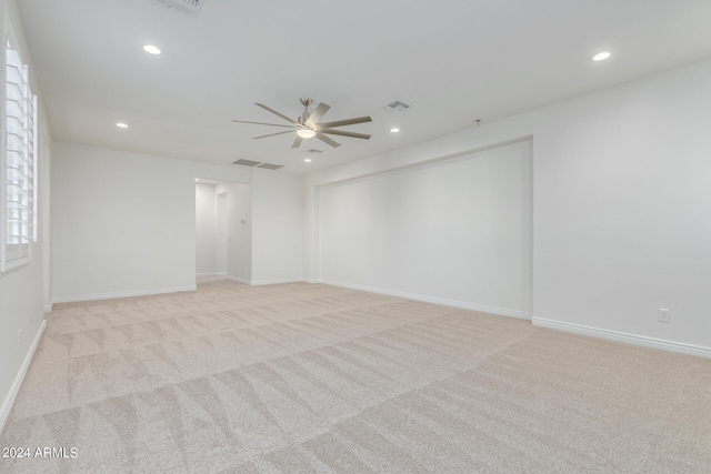 carpeted empty room with ceiling fan