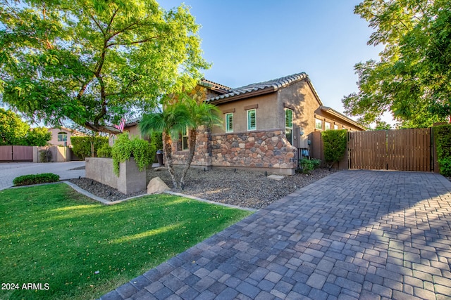 view of side of property with a lawn