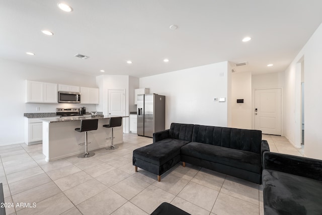 living room featuring light tile patterned floors