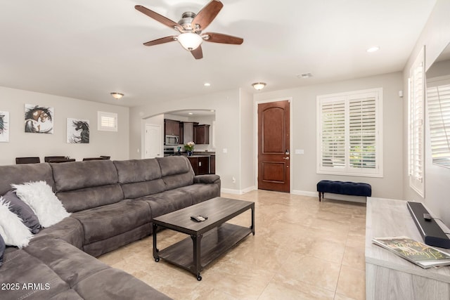 3476 E Orchid Ln, Gilbert, AZ 85296 - living room with a ceiling fan, arched walkways, recessed lighting, and baseboards