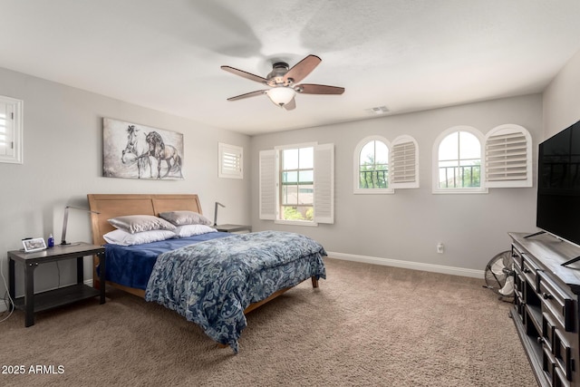 3476 E Orchid Ln, Gilbert, AZ 85296 - carpeted bedroom with baseboards and a ceiling fan
