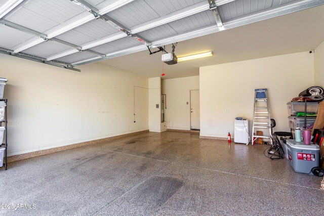 3476 E Orchid Ln, Gilbert, AZ 85296 - garage featuring a garage door opener and baseboards