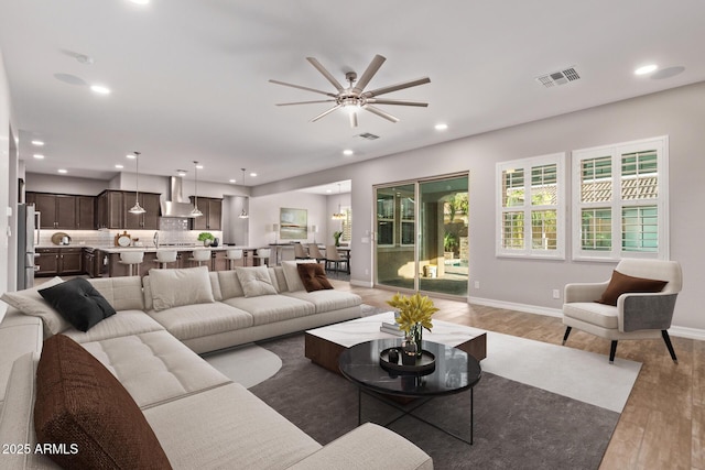 2027 E Ln Costa Ct, Gilbert, AZ 85298 - living area featuring light wood finished floors, ceiling fan, recessed lighting, and baseboards