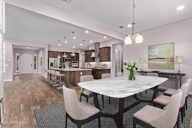2027 E Ln Costa Ct, Gilbert, AZ 85298 - dining area with recessed lighting, baseboards, wood finished floors, and a chandelier