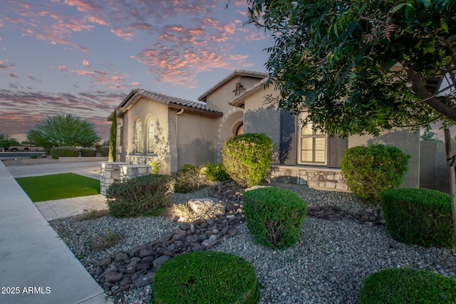 2027 E Ln Costa Ct, Gilbert, AZ 85298 - view of front of property featuring stucco siding, a tile roof, and stone siding