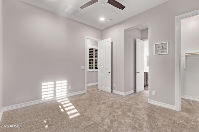 2027 E Ln Costa Ct, Gilbert, AZ 85298 - unfurnished bedroom with carpet, a walk in closet, baseboards, and a ceiling fan