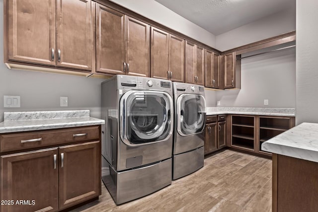 2027 E Ln Costa Ct, Gilbert, AZ 85298 - laundry room with cabinet space, washer and clothes dryer, and light wood finished floors