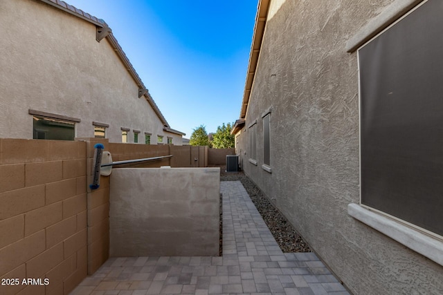 2027 E Ln Costa Ct, Gilbert, AZ 85298 - view of side of property featuring stucco siding and central AC