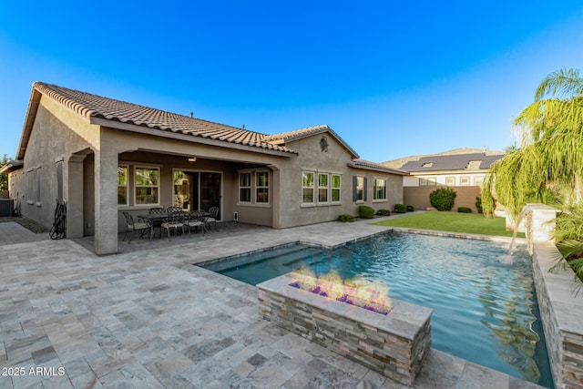 2027 E Ln Costa Ct, Gilbert, AZ 85298 - back of house with a tile roof, stucco siding, a fenced backyard, and a fire pit
