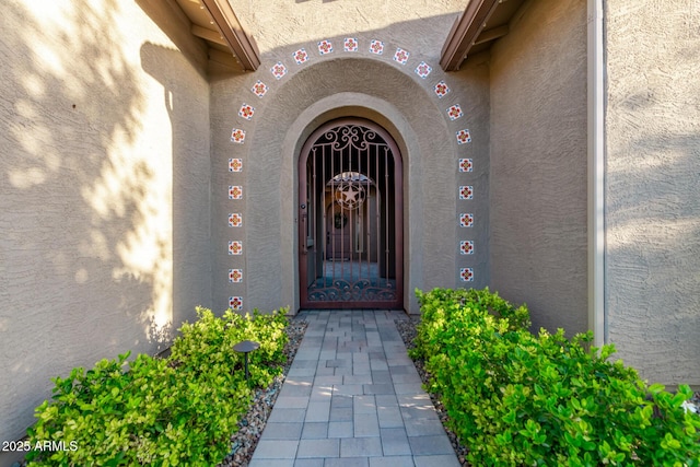 2027 E Ln Costa Ct, Gilbert, AZ 85298 - view of exterior entry featuring stucco siding