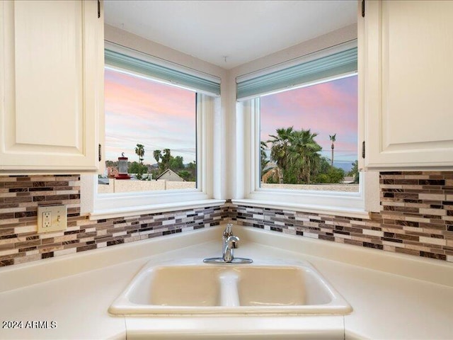 room details with white cabinetry and sink