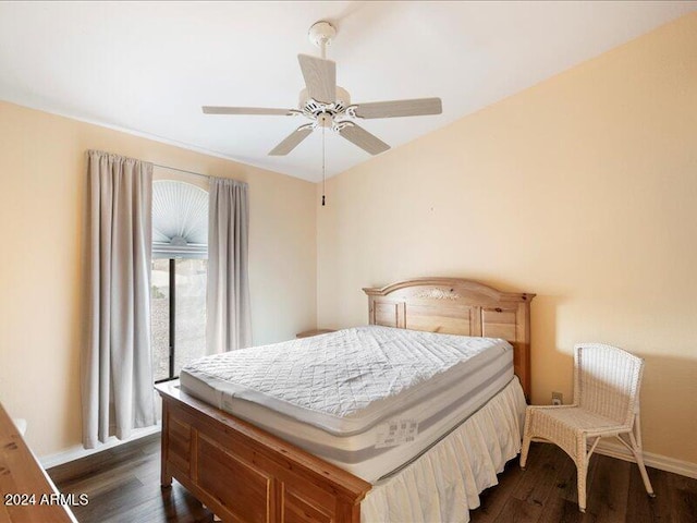 bedroom with ceiling fan, dark hardwood / wood-style floors, and access to exterior