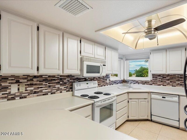 kitchen featuring white cabinetry, sink, tasteful backsplash, ceiling fan, and white appliances